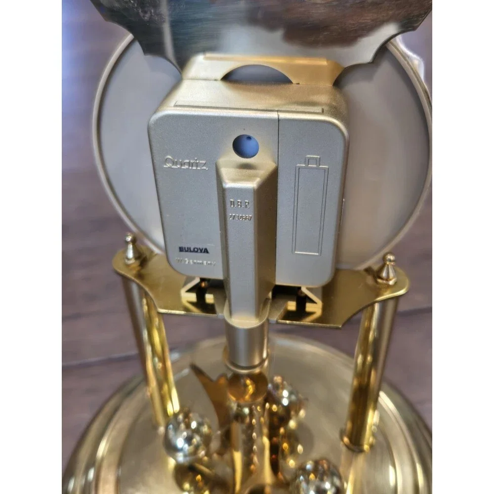 Bulova Tristan I B8818 Anniversary Clock - Glass Dome, Rotating Crystal Pendulum